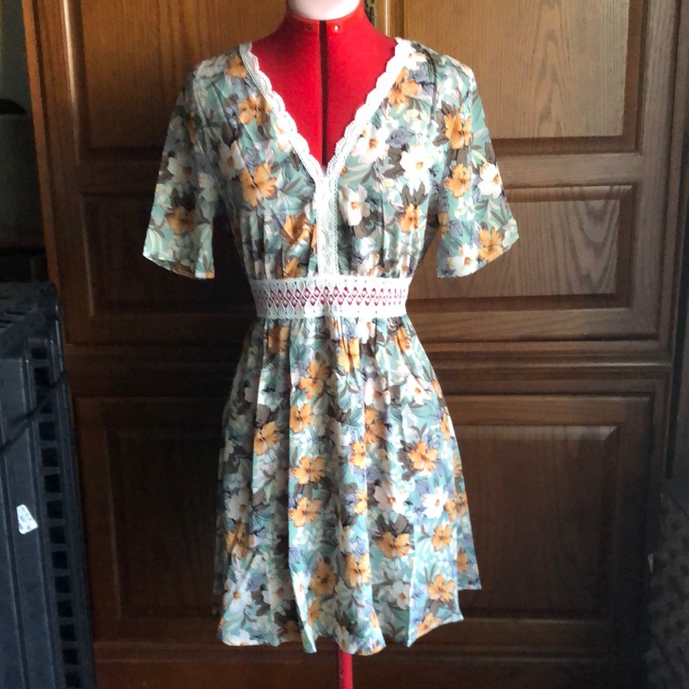 Lovely lace trimmed pale green dress with beautiful flowers,